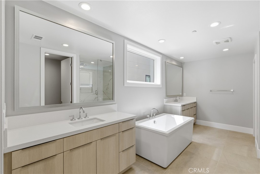 156 Apron Irvine, CA 92618 - Photo 18 of 40 a bathroom with a sink and a mirror