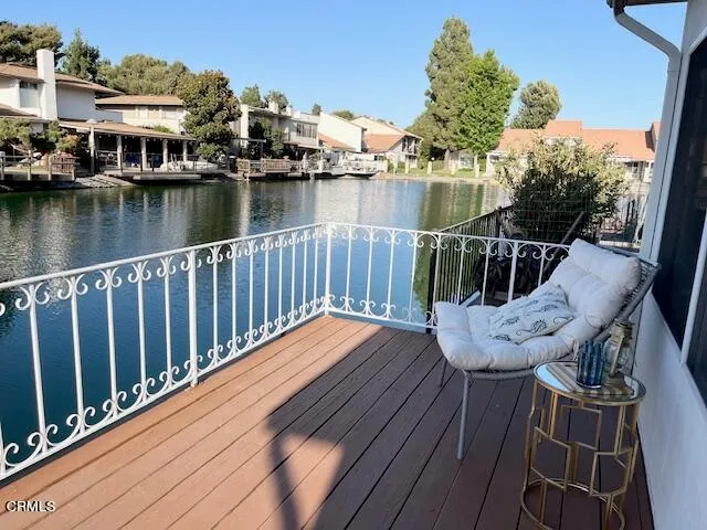 a view of a patio with table and chairs