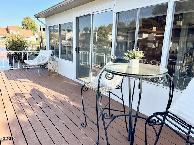 a view of a lake with boats and trees in the background