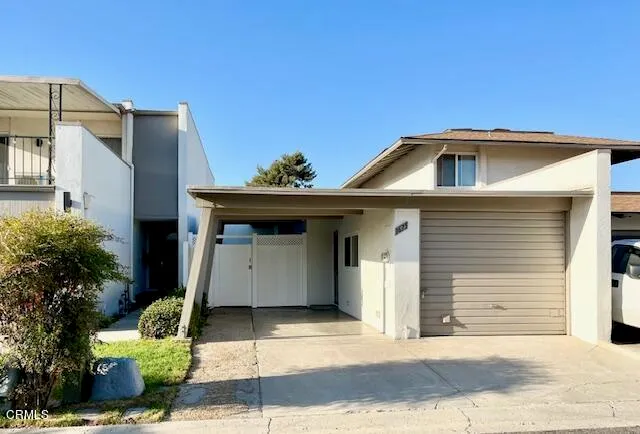 a front view of a house with a garage
