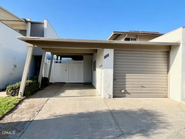 a picture of a living room and a garage