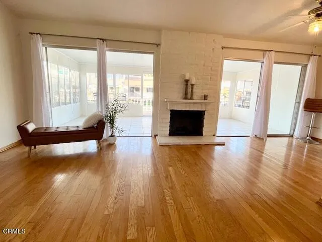 a view of an empty room and wooden floor