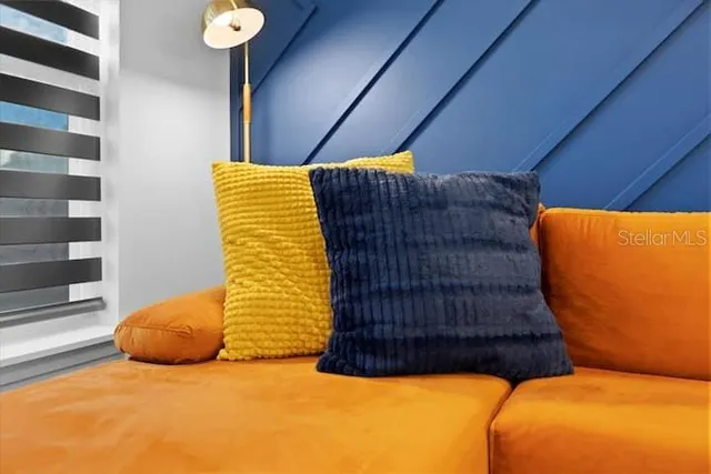 a view of kitchen with stainless steel appliances dining table and chairs