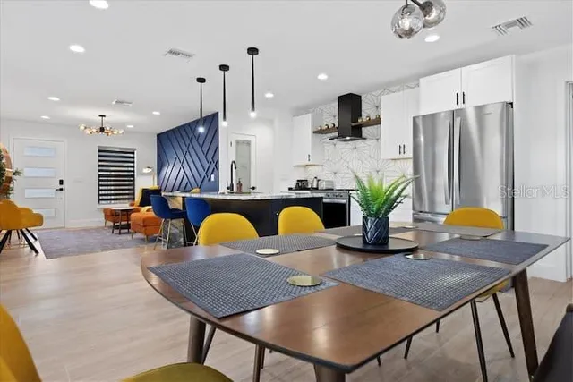 a balcony with chairs and a table