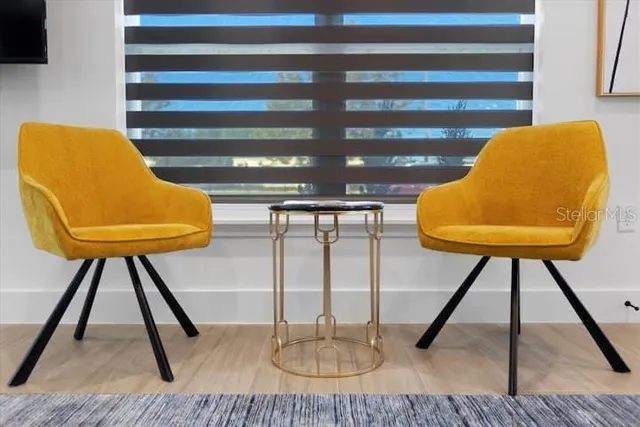 a living room with furniture and a window