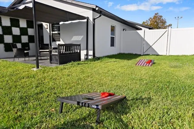 a bedroom with a bed lamp and a window
