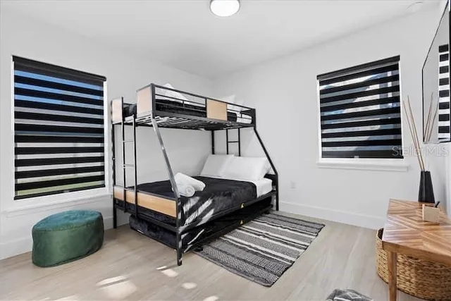 a kitchen with refrigerator and cabinets