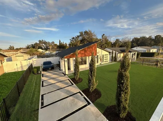 a view of a swimming pool with a yard