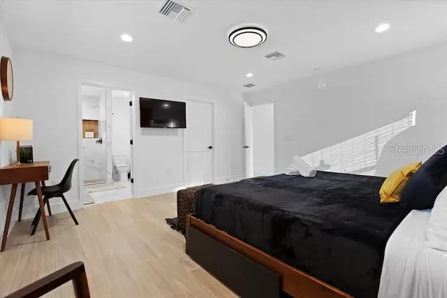 a view of a swimming pool with furniture