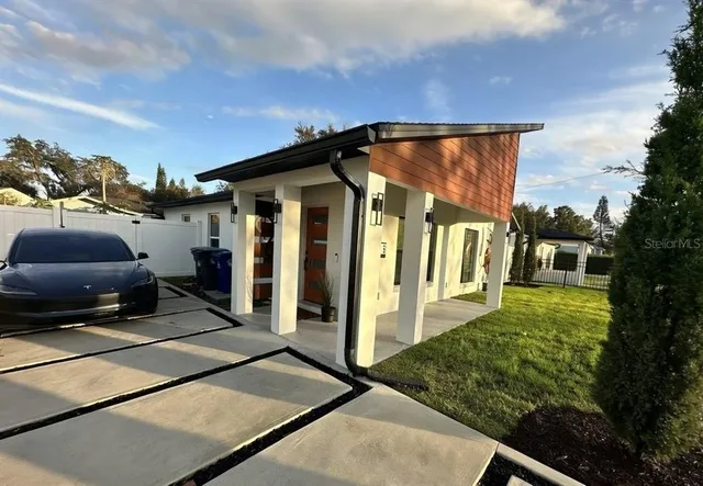 a view of a car park in front of house