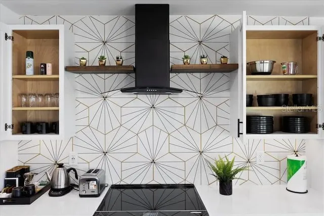 a view of a hallway with seating and a potted plant