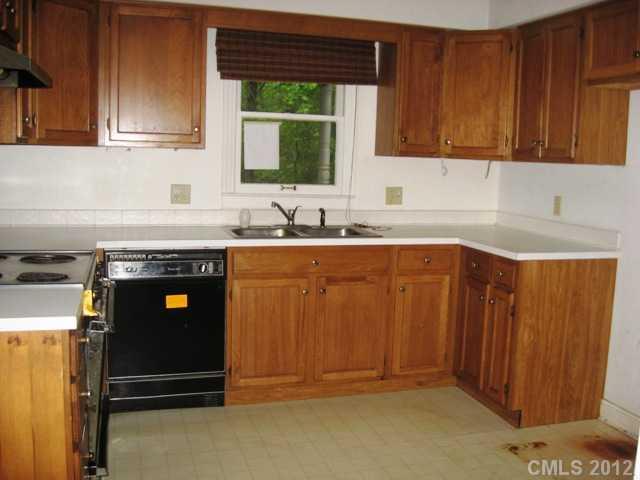 9283 Ladson Road Fort Mill, SC 29707 - Photo 3 of 16 a kitchen with stainless steel appliances granite countertop a sink stove and cabinets