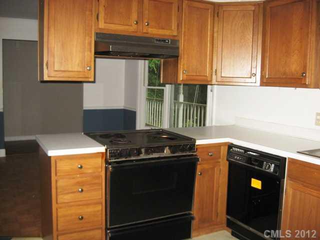 9283 Ladson Road Fort Mill, SC 29707 - Photo 4 of 16 a kitchen with a stove and a sink