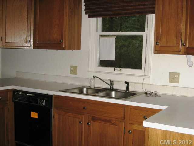 9283 Ladson Road Fort Mill, SC 29707 - Photo 5 of 16 a kitchen with stainless steel appliances granite countertop a sink and a microwave