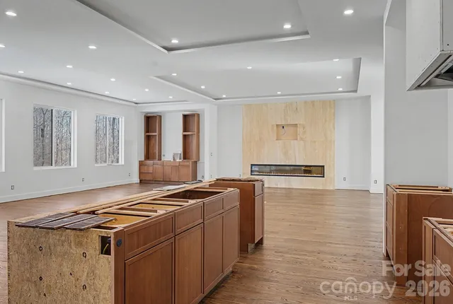 a kitchen with stainless steel appliances granite countertop a stove and a refrigerator