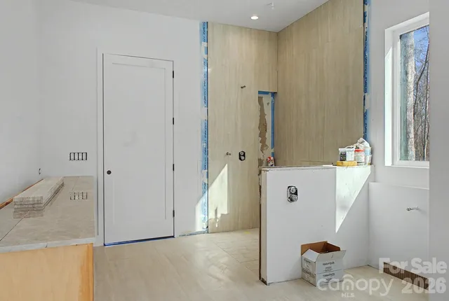 a view of room with furniture and wooden floor
