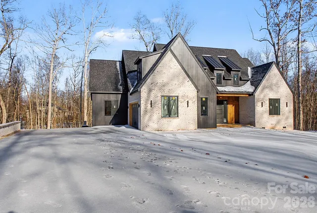 a view of a house and a yard