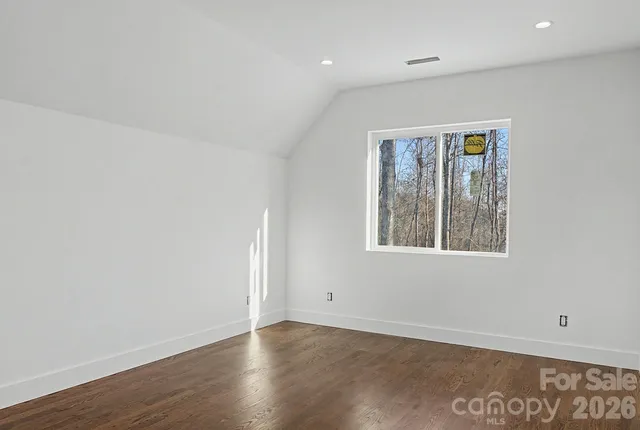a bathroom with a granite countertop sink a mirror and shower