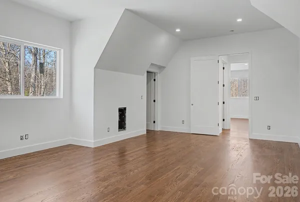 a view of room with wooden floor