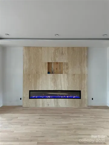 a room with two chair and a refrigerator