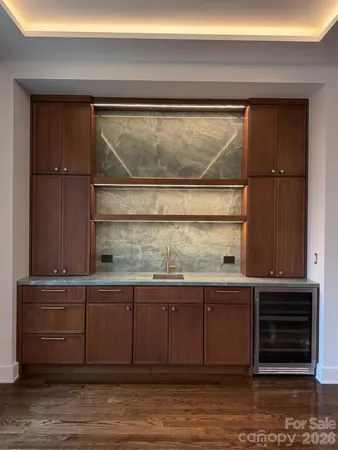 a view of a kitchen with a sink and cabinets