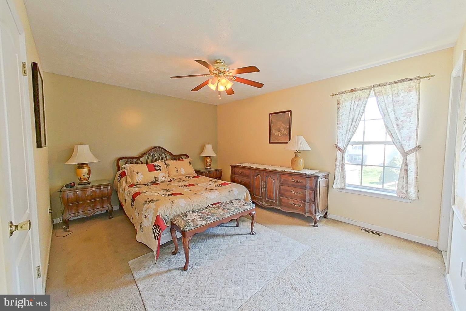1 Bancroft Street Taneytown, MD 21787 - Photo 14 of 35 a bedroom with a bed and a chandelier