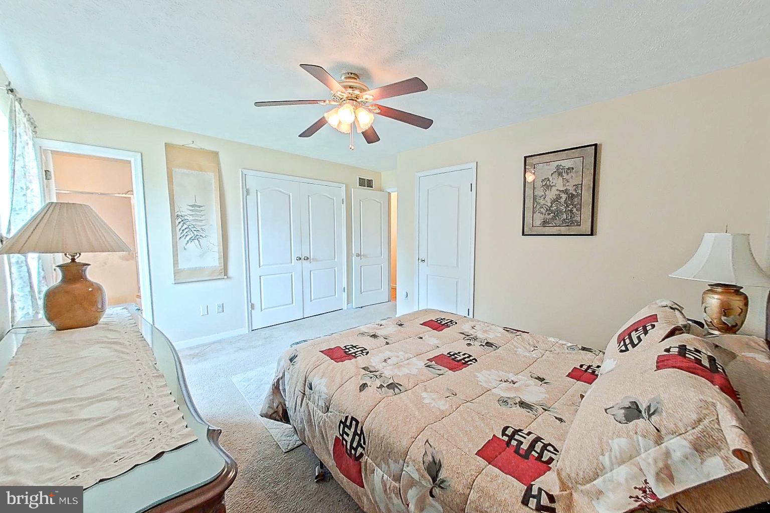 1 Bancroft Street Taneytown, MD 21787 - Photo 15 of 35 a bedroom with a bed and a chandelier