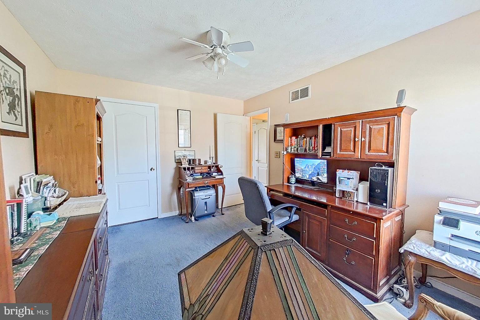 1 Bancroft Street Taneytown, MD 21787 - Photo 20 of 35 a view of a livingroom with furniture and a flat screen tv