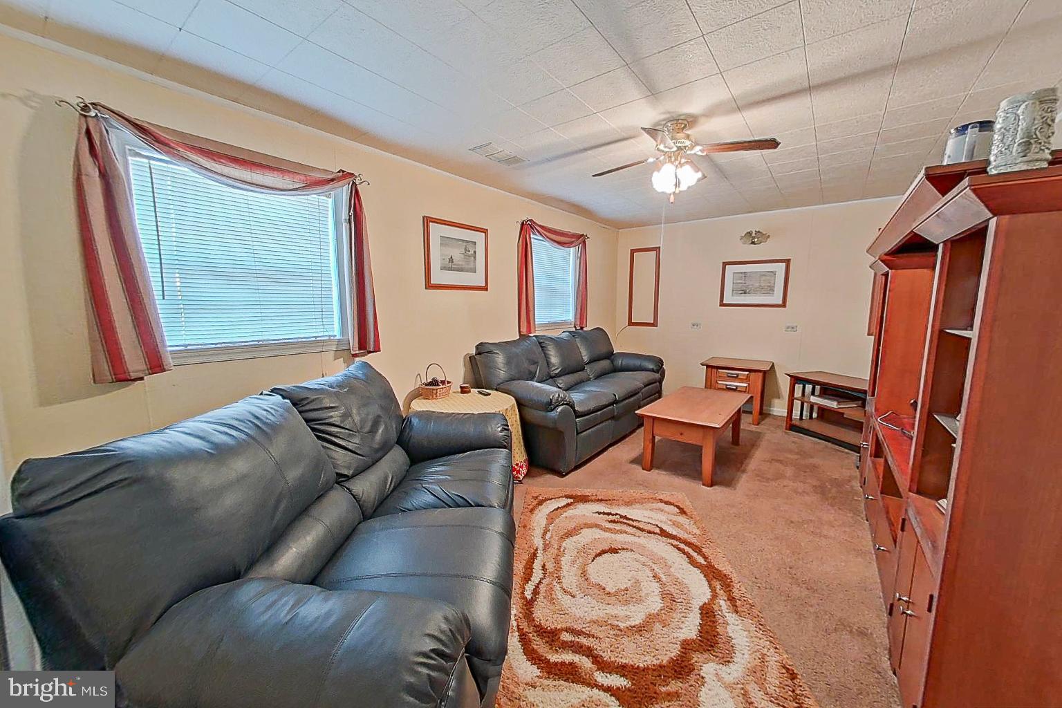 1 Bancroft Street Taneytown, MD 21787 - Photo 23 of 35 a living room with furniture and a chandelier