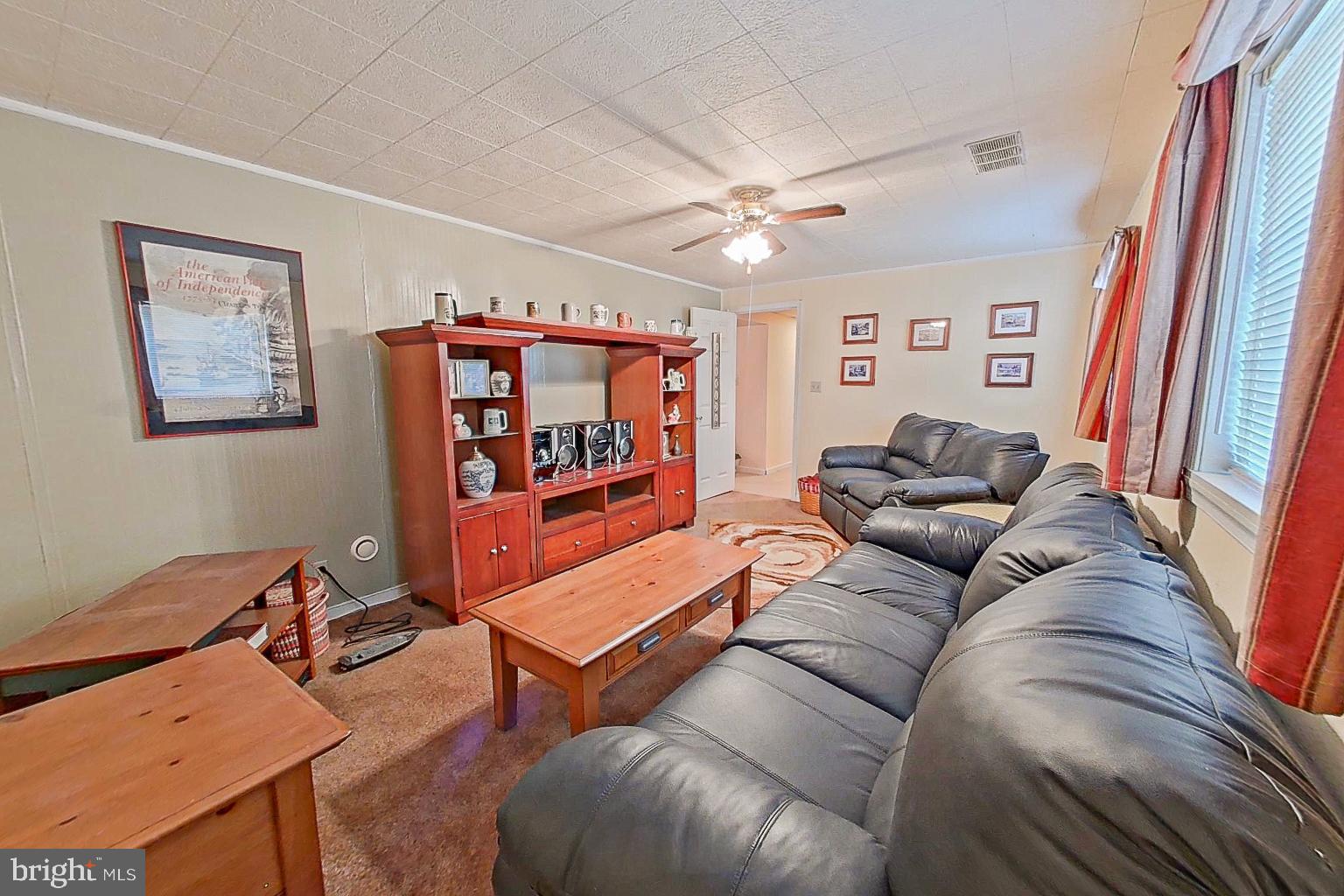 1 Bancroft Street Taneytown, MD 21787 - Photo 24 of 35 a living room with furniture a ceiling fan and a rug