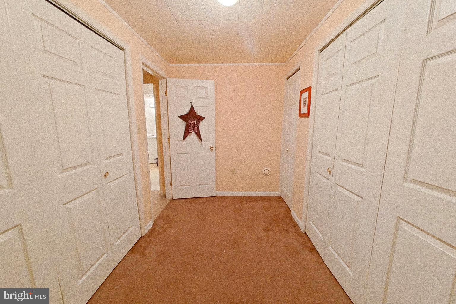 1 Bancroft Street Taneytown, MD 21787 - Photo 28 of 35 a view of a hallway with wooden floor and closet