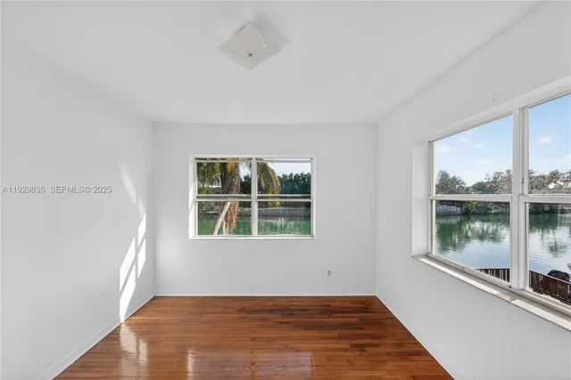 a view of a backyard with swimming pool