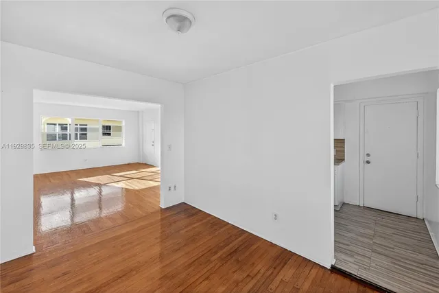 a view of a pathway with a house in the background