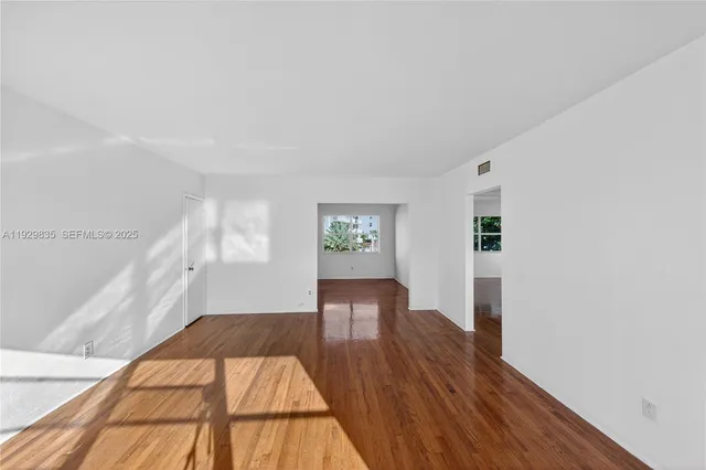 a view of a balcony with lake view and a floor to ceiling window