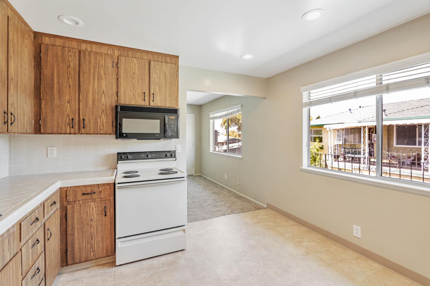 869 Bing Drive Santa Clara, CA 95051 - Photo 8 of 11 a kitchen with white cabinets and white appliances