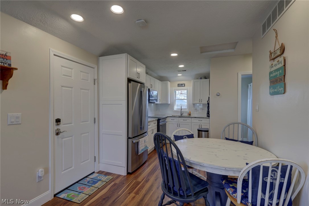 189 Harcourt Road Vermilion, OH 44089 - Photo 10 of 36 Dining area featuring dark wood-style floors and recessed lighting