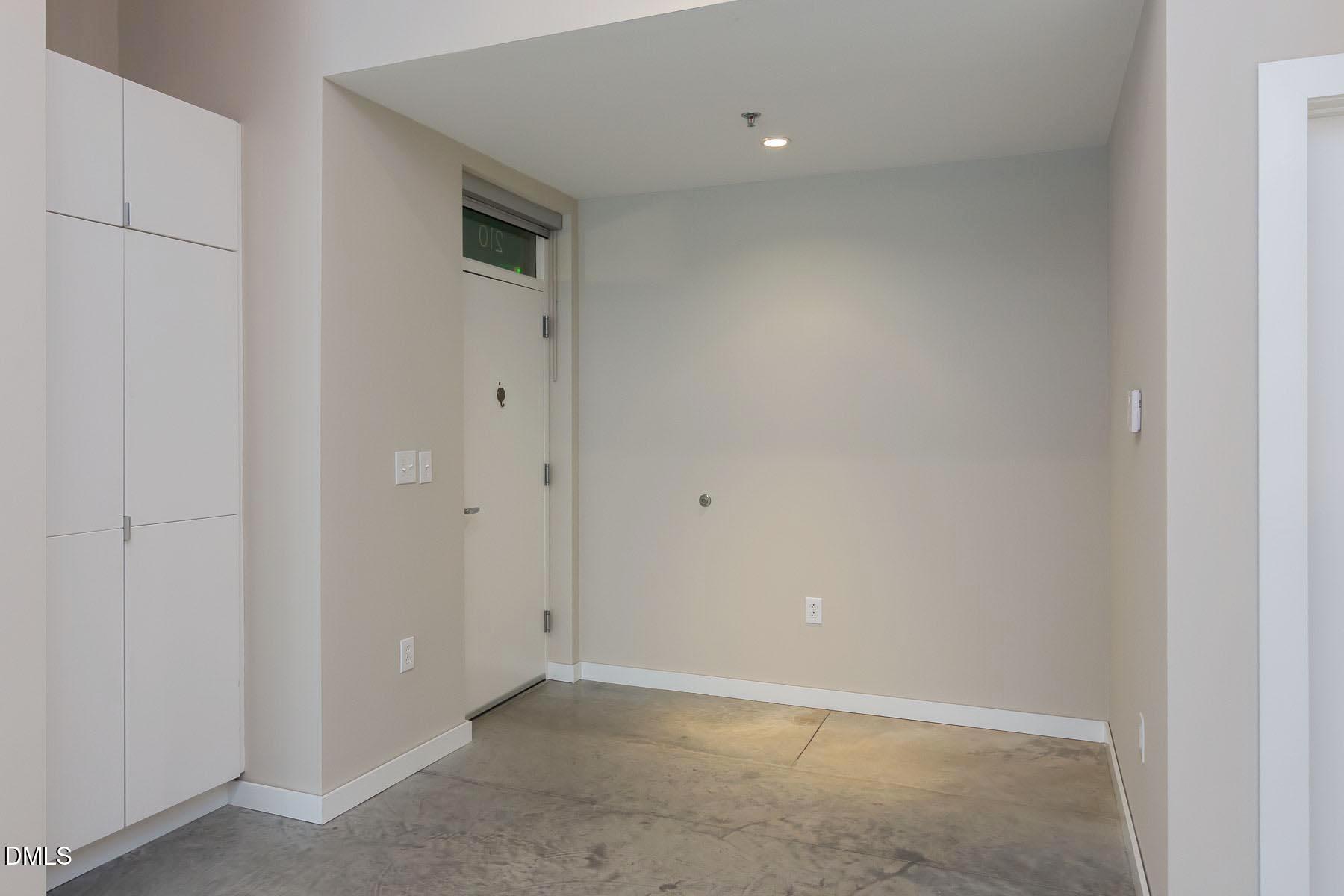 319 Fayetteville Street, Unit 210 Raleigh, NC 27601 - Photo 5 of 32 a view of an empty room