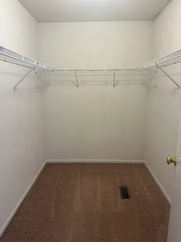 a view of a room with racks on the wall