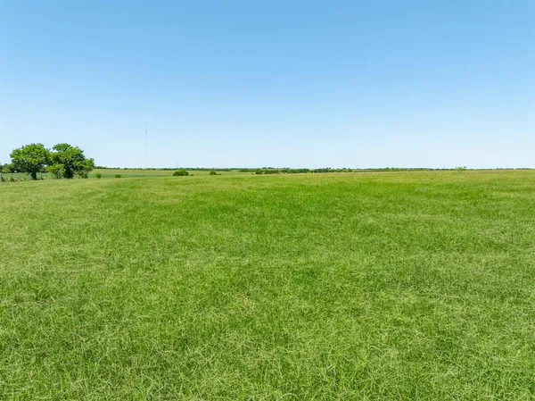 a view of a field with an outdoor space