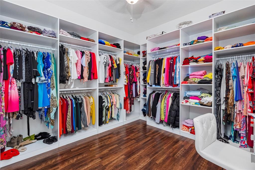 9336 Tooke Shore Drive Weeki Wachee, FL 34613 - Photo 17 of 44 a view of walk in closet with clothes and shoes