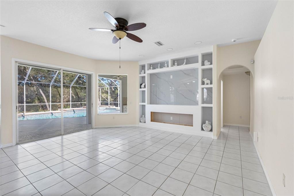 9336 Tooke Shore Drive Weeki Wachee, FL 34613 - Photo 29 of 44 a view of an empty room with a window and kitchen view
