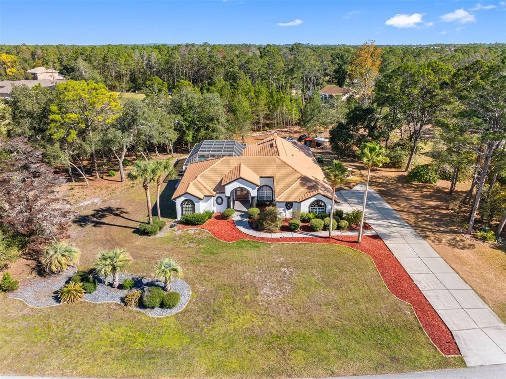 9336 Tooke Shore Drive Weeki Wachee, FL 34613 - Photo 3 of 44 a view of a houses with yard