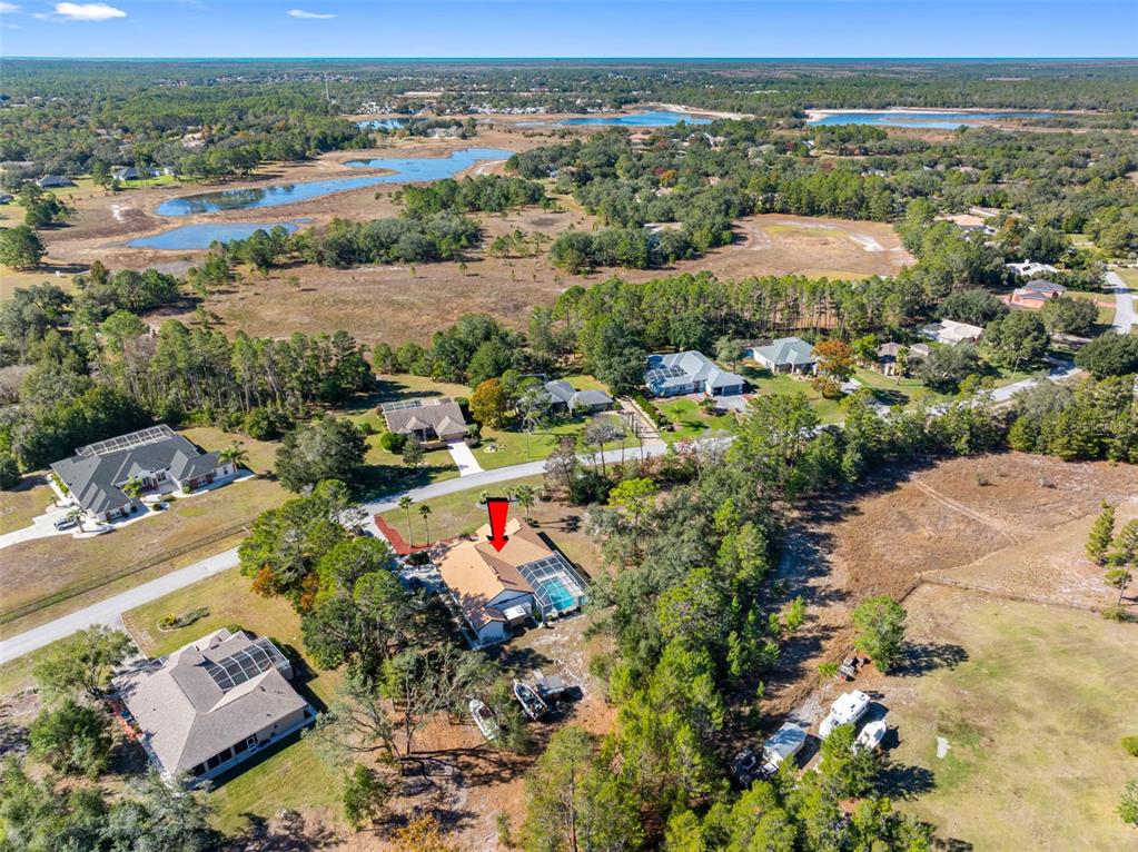 9336 Tooke Shore Drive Weeki Wachee, FL 34613 - Photo 43 of 44 an aerial view of residential houses with outdoor space