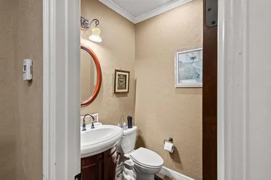 a bedroom with a bed and dresser with mirror