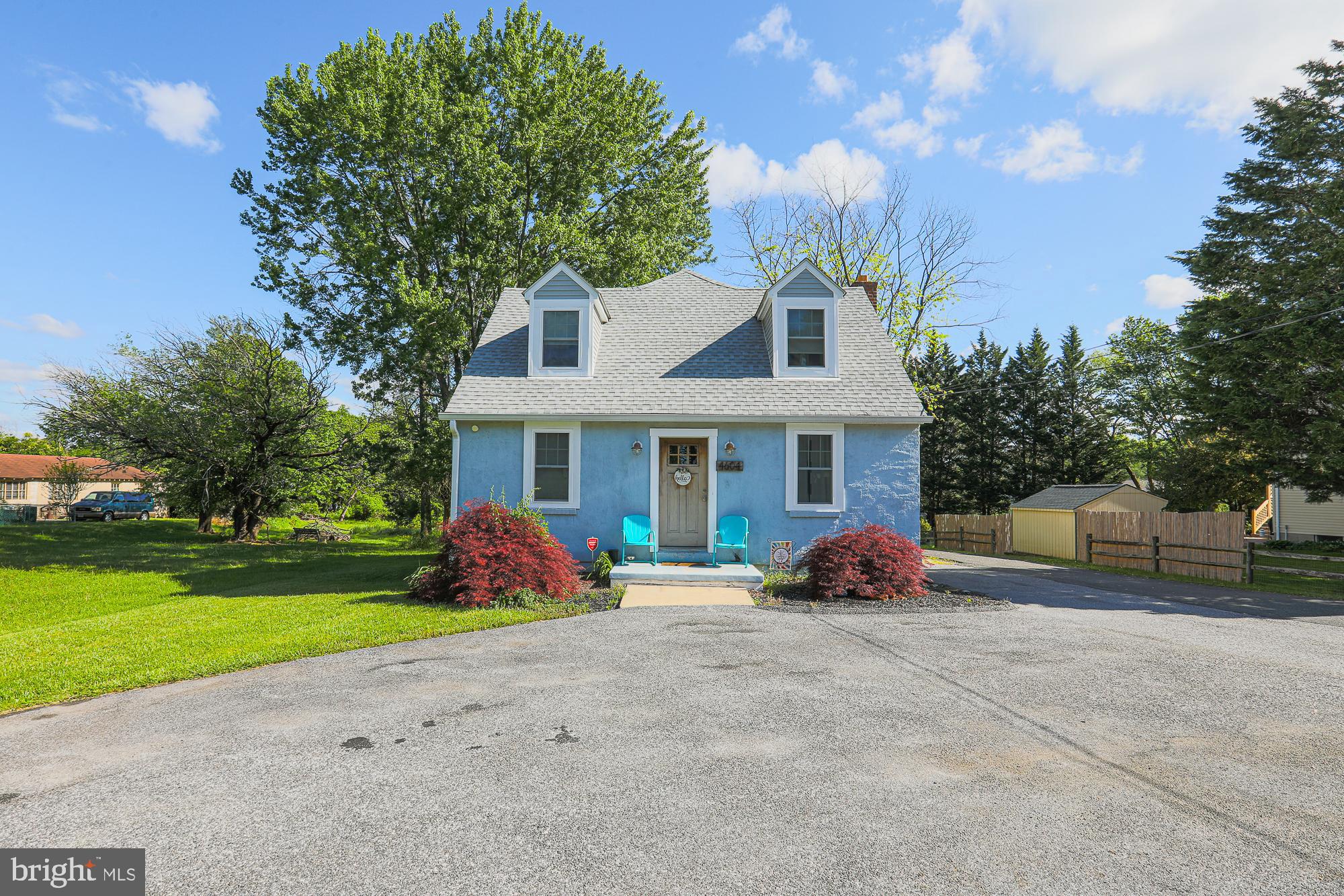 4604 East Joppa Road Perry Hall, MD 21128 - Photo 2 of 56 a front view of a house with garden and porch