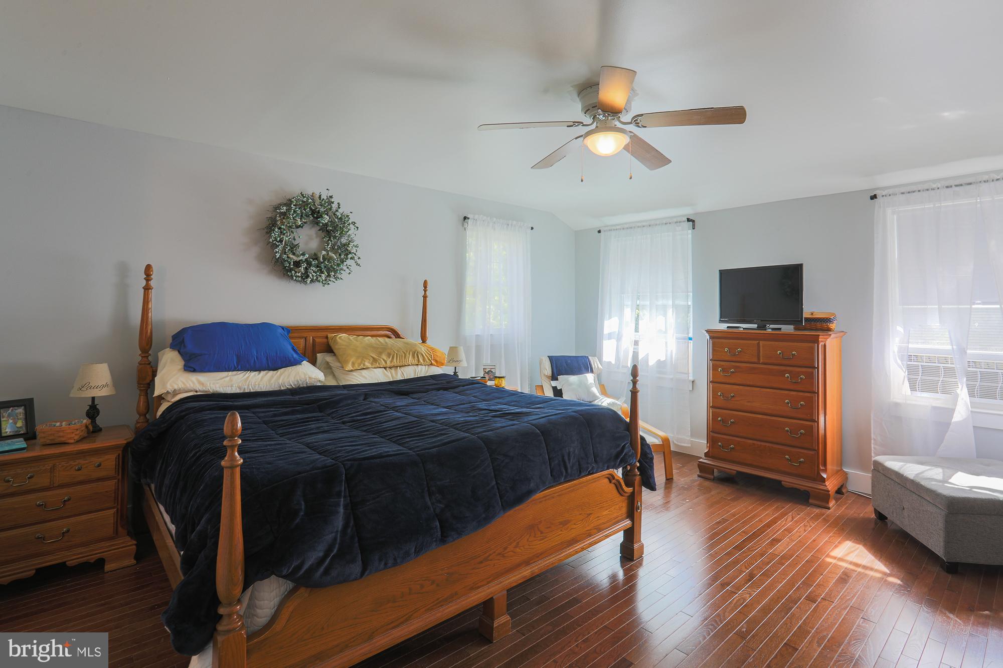 4604 East Joppa Road Perry Hall, MD 21128 - Photo 21 of 56 a bedroom with a bed and a flat screen tv