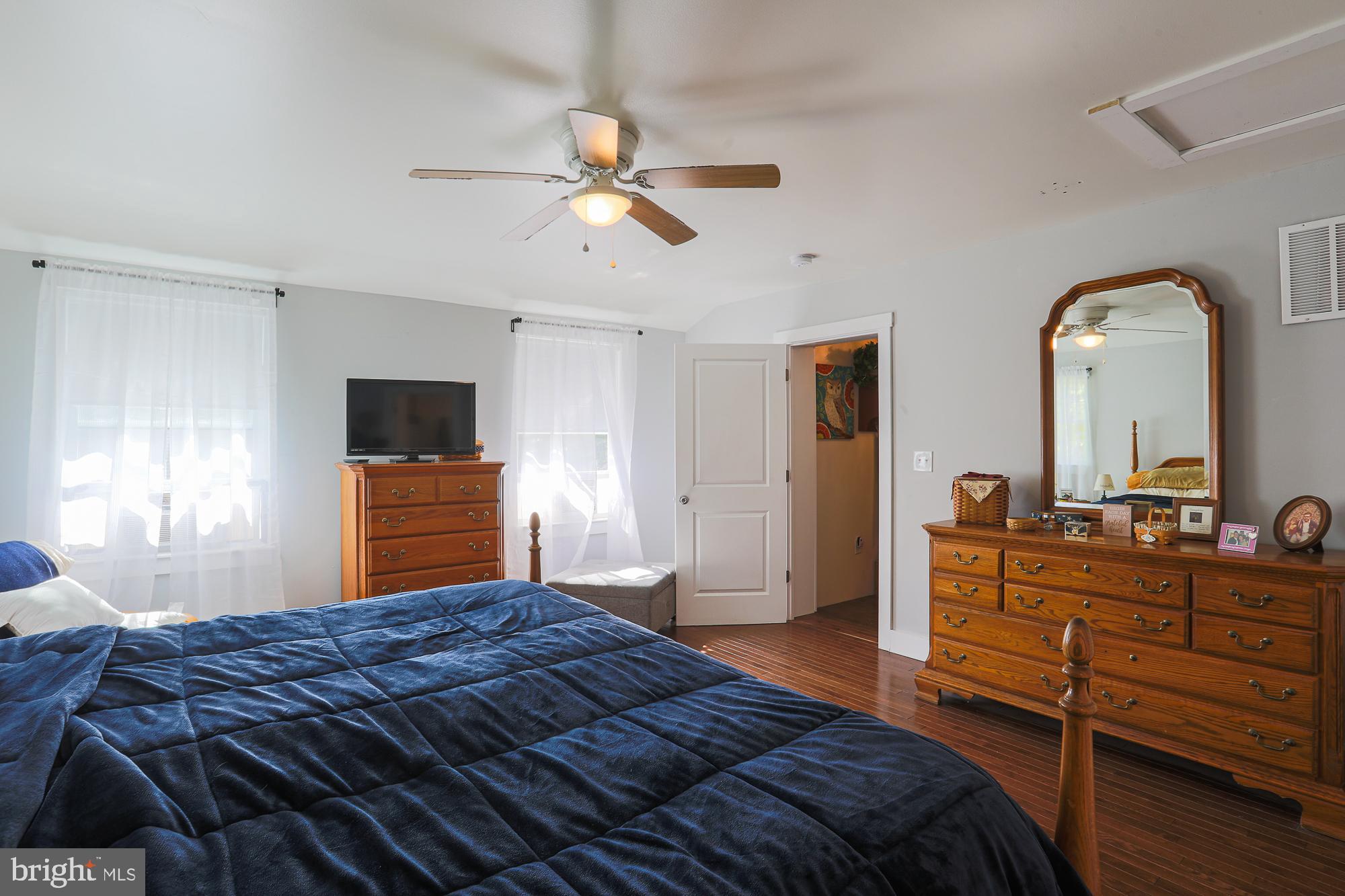 4604 East Joppa Road Perry Hall, MD 21128 - Photo 22 of 56 a bedroom with a bed and a chandelier
