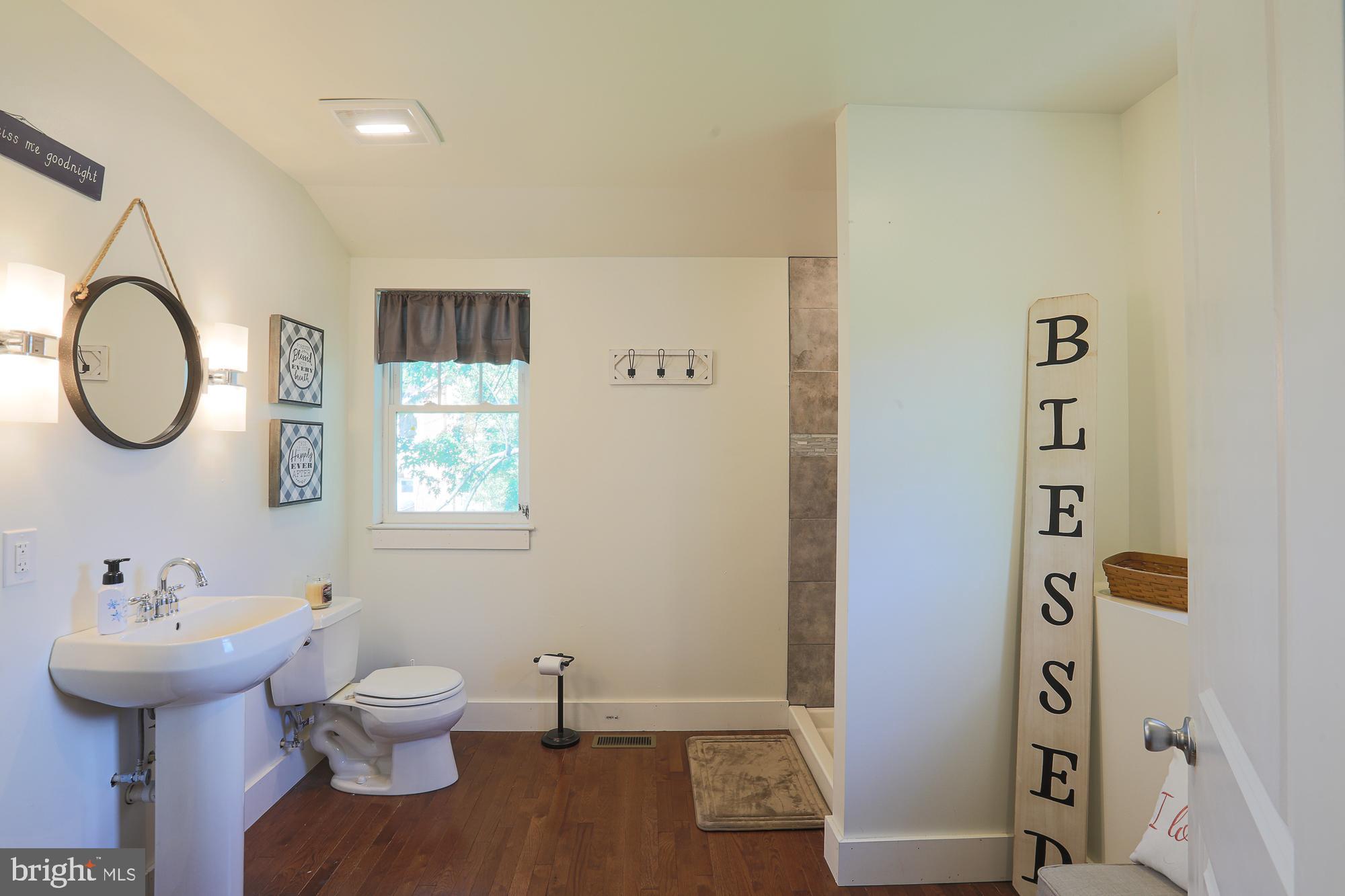 4604 East Joppa Road Perry Hall, MD 21128 - Photo 24 of 56 a bathroom with a sink and a mirror