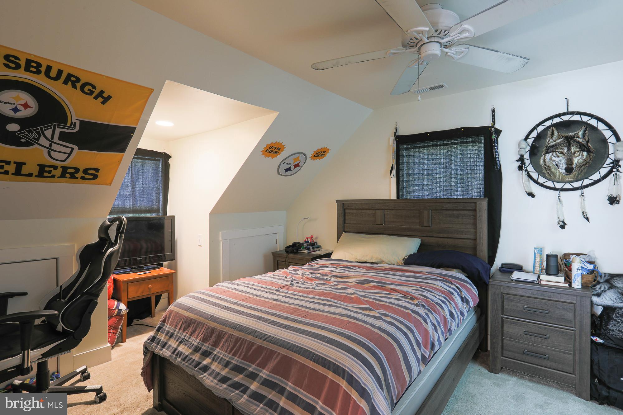 4604 East Joppa Road Perry Hall, MD 21128 - Photo 27 of 56 a bedroom with a bed and a chandelier