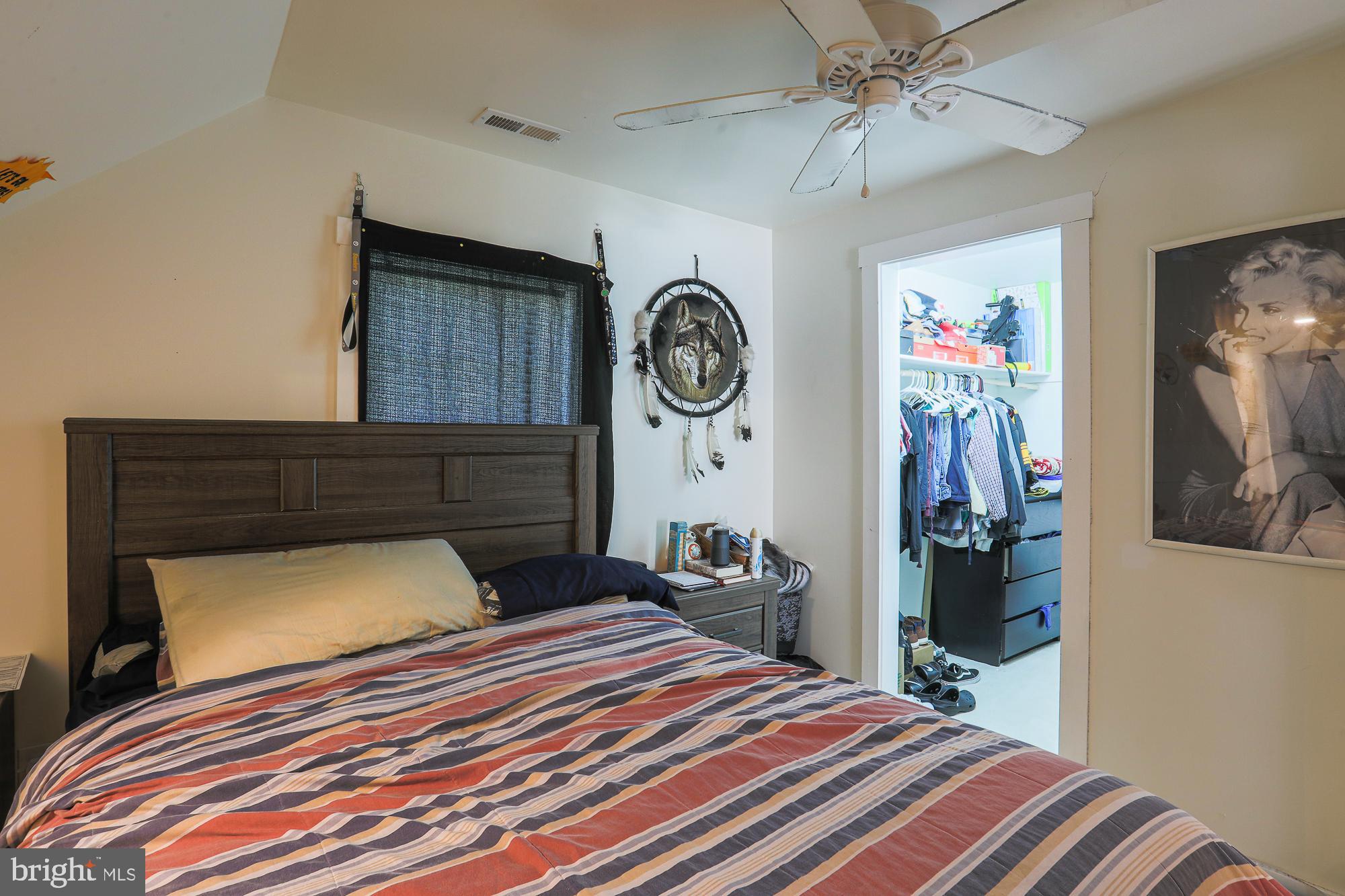 4604 East Joppa Road Perry Hall, MD 21128 - Photo 28 of 56 a bedroom with a bed and a chandelier